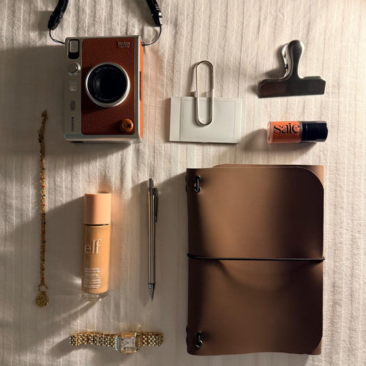 Tan handmade journal flat lay with tools — Arc and Axis UAE