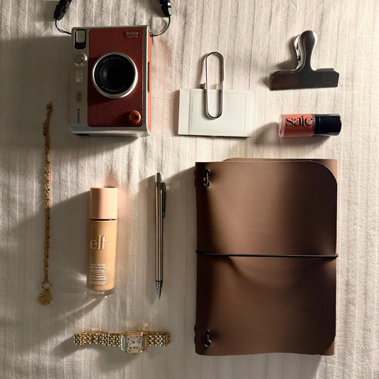 A5 tan faux leather journal flat lay — Arc and Axis UAE