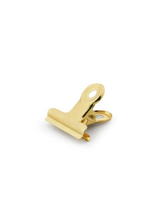 Golden tail clip bookmark on a handmade faux leather journal — Arc and Axis UAE