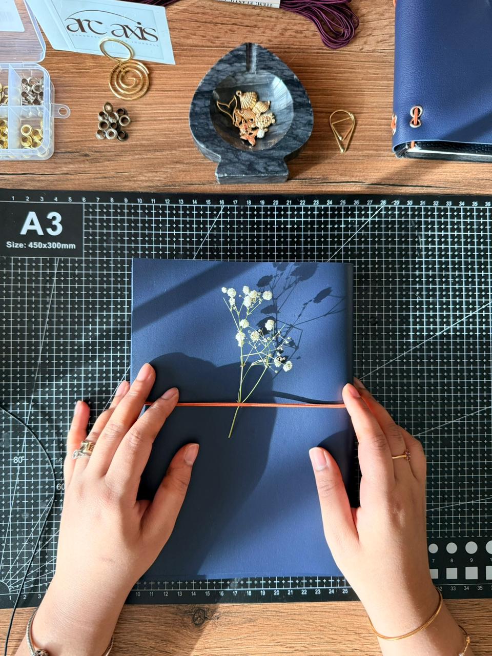 Arc and Axis journal gift-wrapped in kraft packaging